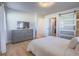 Bright bedroom with TV and closet; featuring a comfortable king-sized bed at 10768 Ditchburn Ct, Las Vegas, NV 89166