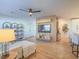 Open-concept living space with modern furnishings, a sleek TV console, and stylish accents for a contemporary feel at 10768 Ditchburn Ct, Las Vegas, NV 89166