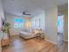 Inviting living room with modern furnishings, ceiling fan, and natural light from the windows at 10768 Ditchburn Ct, Las Vegas, NV 89166