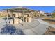 Shaded picnic area with modern tables and benches, perfect for outdoor dining and gatherings at 10768 Ditchburn Ct, Las Vegas, NV 89166