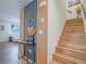 View of entryway with a staircase featuring wood treads and decorative wall accents at 10768 Ditchburn Ct, Las Vegas, NV 89166