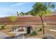 Beautiful common area featuring comfortable seating, outdoor fireplace, and landscaped desert-style surroundings at 10985 Limeslice Ave # 2, Las Vegas, NV 89135
