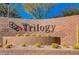 Attractive community sign for Trilogy set in a landscaped desert environment at 10985 Limeslice Ave # 2, Las Vegas, NV 89135