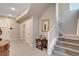 Inviting entryway featuring tile floors, a staircase, and tasteful decor at 10985 Limeslice Ave # 2, Las Vegas, NV 89135