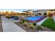 Modern pickleball court nestled among lush landscaping and green space in a common area at 10985 Limeslice Ave # 2, Las Vegas, NV 89135