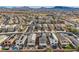 Birds-eye view of a meticulously planned residential community featuring solar panels, in a desert setting at 117 Blue Trout Ave, Henderson, NV 89011