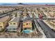 Overhead shot of a suburban home with a lush backyard pool and patio, in a Gathering-friendly neighborhood at 117 Blue Trout Ave, Henderson, NV 89011