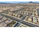 Detailed view of suburban homes with private pools, and a neighborhood of well-maintained desert landscaping at 117 Blue Trout Ave, Henderson, NV 89011