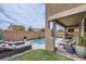 Beautiful backyard pool area with lounge chairs and outdoor seating, perfect for relaxation at 117 Blue Trout Ave, Henderson, NV 89011