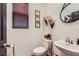 Stylish powder room features a modern sink, decor, and hardwood flooring at 117 Blue Trout Ave, Henderson, NV 89011