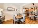 Cozy dining space with hardwood floors, adjacent to a modern kitchen for easy access and convenience at 117 Blue Trout Ave, Henderson, NV 89011