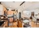 Bright kitchen features stainless appliances, eat-in island with granite countertops, and hardwood flooring at 117 Blue Trout Ave, Henderson, NV 89011