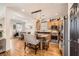 Modern kitchen with stainless steel appliances, hardwood floors, and granite countertops at 117 Blue Trout Ave, Henderson, NV 89011