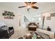 Inviting living room featuring neutral tones, comfortable seating, and a ceiling fan at 117 Blue Trout Ave, Henderson, NV 89011