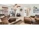 Bright living room with an entertainment center, stylish furnishings, and plenty of natural light at 117 Blue Trout Ave, Henderson, NV 89011