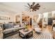 Spacious living area with hardwood floors and open layout to dining and kitchen areas at 117 Blue Trout Ave, Henderson, NV 89011
