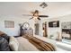Cozy main bedroom features a large bed, decorative elements, and a ceiling fan at 117 Blue Trout Ave, Henderson, NV 89011