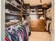 Walk-in closet with custom shelving and ample storage space for clothes and accessories at 117 Blue Trout Ave, Henderson, NV 89011