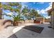 Backyard features desert landscaping, storage shed, and a hot tub at 1334 Shimmering Glen Ave, Henderson, NV 89014