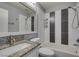 Bathroom features a granite countertop, a large mirror, and a shower with a tub at 1334 Shimmering Glen Ave, Henderson, NV 89014