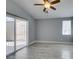 Spacious bedroom featuring tile flooring, ceiling fan and sliding glass doors at 1334 Shimmering Glen Ave, Henderson, NV 89014