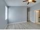 Bedroom features wood-look flooring, ceiling fan, and en-suite bathroom at 1334 Shimmering Glen Ave, Henderson, NV 89014