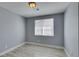 Bright, simple bedroom with a neutral color scheme, window, and wood-look floors at 1334 Shimmering Glen Ave, Henderson, NV 89014