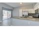 Kitchen with a breakfast bar, stainless appliances, sliding glass door, and backyard access at 1334 Shimmering Glen Ave, Henderson, NV 89014