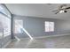 Bright living room featuring wood-look flooring, a large window, and a ceiling fan at 1334 Shimmering Glen Ave, Henderson, NV 89014