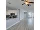 Open-concept living space leading to the kitchen with a breakfast bar and modern appliances at 1334 Shimmering Glen Ave, Henderson, NV 89014