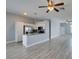 Spacious open-concept living space and kitchen with stainless appliances and a breakfast bar at 1334 Shimmering Glen Ave, Henderson, NV 89014