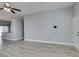 Open-concept living space with sleek floors, ceiling fan, and access to the kitchen at 1334 Shimmering Glen Ave, Henderson, NV 89014