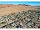Overhead shot of a well-planned suburban neighborhood near desert landscape and rolling hills at 1630 Sundown Dr, Henderson, NV 89002