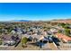 An aerial view of the property nestled in a residential neighborhood against a mountain backdrop at 1630 Sundown Dr, Henderson, NV 89002