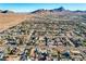 Expansive aerial view of a desert community with mountain backdrop and a mix of single-Gathering homes at 1630 Sundown Dr, Henderson, NV 89002