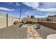 Outdoor living space boasts a fire pit, patio area, and lush landscaping for outdoor relaxation and entertaining at 1630 Sundown Dr, Henderson, NV 89002