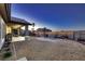 Outdoor space with patio, dining area, lounge chairs, and gravel landscaping at 1630 Sundown Dr, Henderson, NV 89002