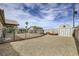 A spacious backyard featuring decorative gravel, a shed, and well-defined fenced boundaries at 1630 Sundown Dr, Henderson, NV 89002