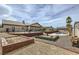 Expansive backyard with a fire pit, patio space, and well-manicured landscaping for an outdoor oasis at 1630 Sundown Dr, Henderson, NV 89002