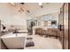 Bright bathroom with tile flooring, a soaking tub, walk-in shower, and double vanity at 1630 Sundown Dr, Henderson, NV 89002