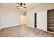 Bedroom features a ceiling fan, closet and plank flooring at 1630 Sundown Dr, Henderson, NV 89002