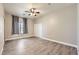 Bedroom featuring ceiling fan, window with natural light, and plank flooring at 1630 Sundown Dr, Henderson, NV 89002