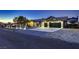 Charming single-story home with manicured landscaping, three-car garage, and RV parking at 1630 Sundown Dr, Henderson, NV 89002