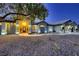 Inviting home exterior with manicured front yard, walkway, and outdoor lighting at 1630 Sundown Dr, Henderson, NV 89002
