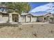 Inviting home exterior with manicured front yard, walkway, and desert landscaping at 1630 Sundown Dr, Henderson, NV 89002