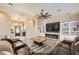 Comfortable living area showcasing an open floorplan with built-ins, fireplace and modern furnishings at 1630 Sundown Dr, Henderson, NV 89002