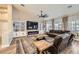 Relaxing living room featuring built-in shelving, fireplace, comfortable seating and natural light at 1630 Sundown Dr, Henderson, NV 89002