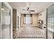 Bright living room features a ceiling fan, neutral tones, and wood-look floors at 1630 Sundown Dr, Henderson, NV 89002