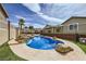 Inviting backyard featuring an inground pool with rock accents and water features for relaxing outdoor enjoyment at 1630 Sundown Dr, Henderson, NV 89002