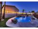 Beautiful inground pool featuring rocks, waterfalls, and a spa creating an inviting backyard retreat at 1630 Sundown Dr, Henderson, NV 89002